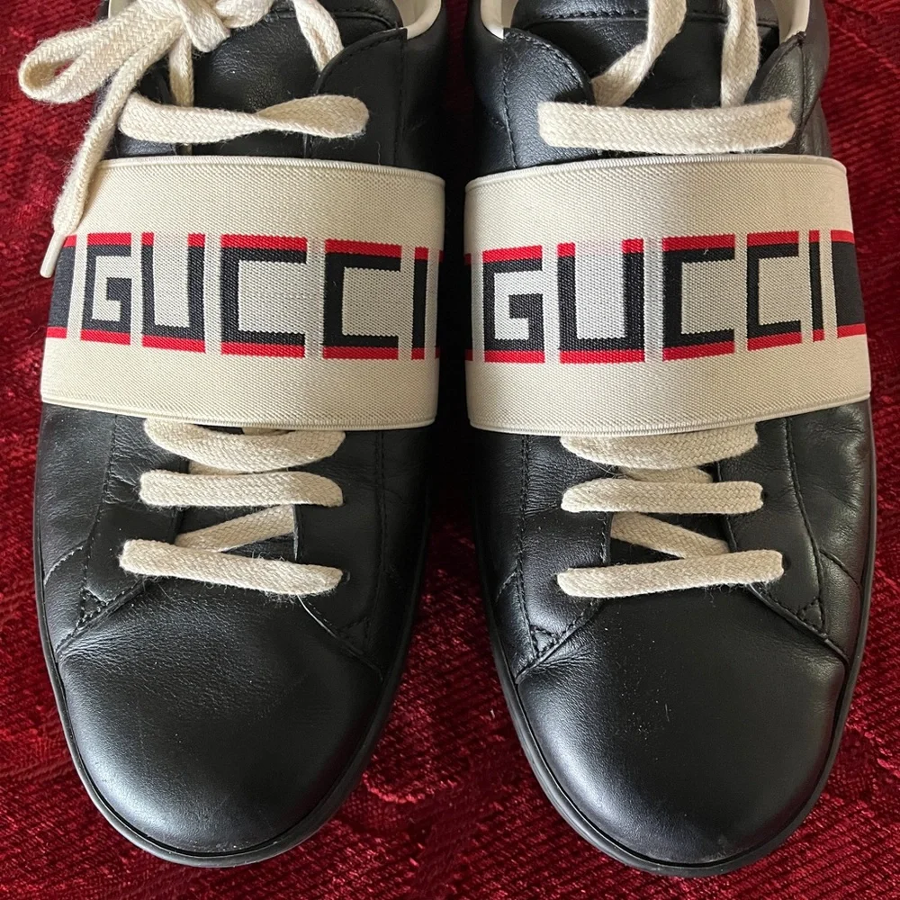 Gucci Black Leather Sneakers with Beige Logo Strap and Red Heel Accent